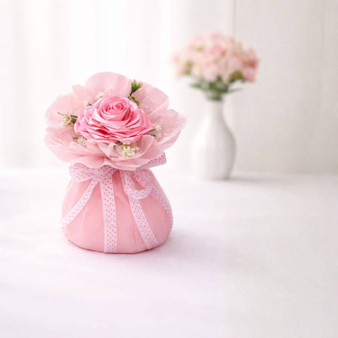 Baby Pink Satin Ribbon Rose Bouquet – handcrafted baby pink satin rose with tulle organza sparkle wrap, white filler blooms and polka-dot ribbon bow, ready-to-gift decorative arrangement