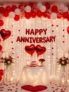 Anniversary 63 Combo Set – 63-piece red and white romantic decoration kit with heart foil balloons, LED lights, net backdrop and Happy Anniversary banner