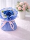 Blue Satin Ribbon Rose Bouquet – handcrafted decorative floral arrangement with ribbon roses and accent greenery for gifting and home décor